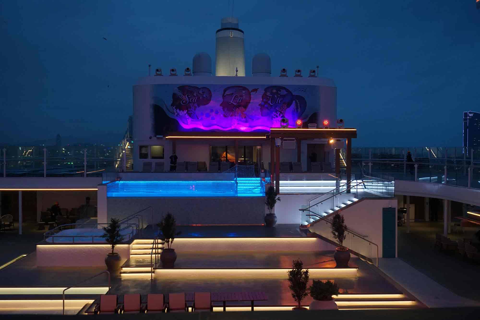 Mein Schiff Relax Infinity Pool on the Agora deck at night